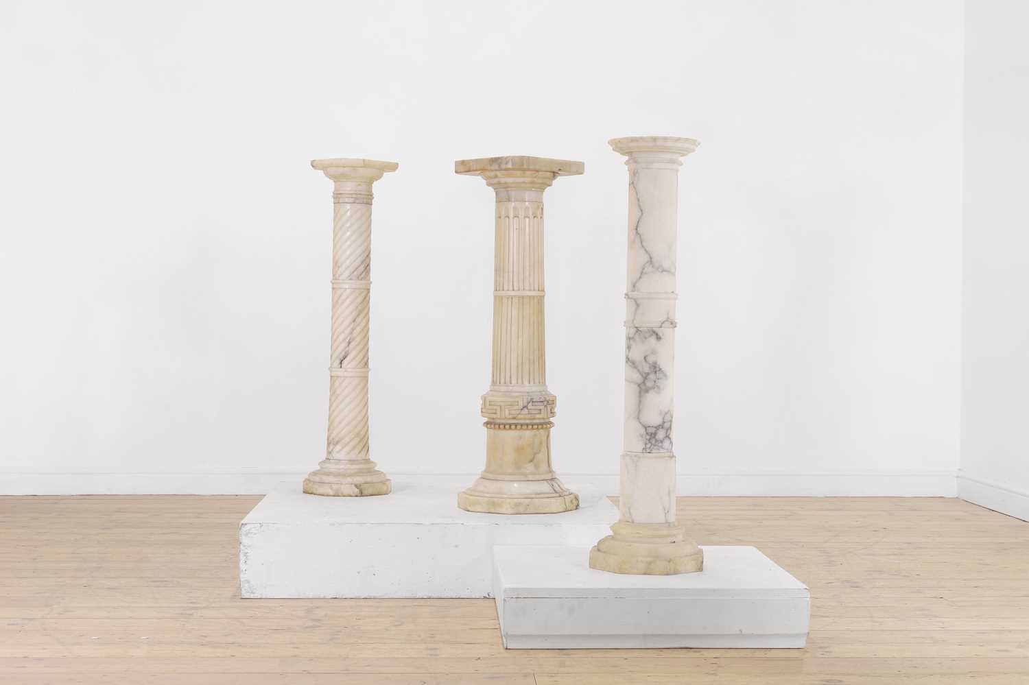 Lot 372 - A group of three alabaster pedestals