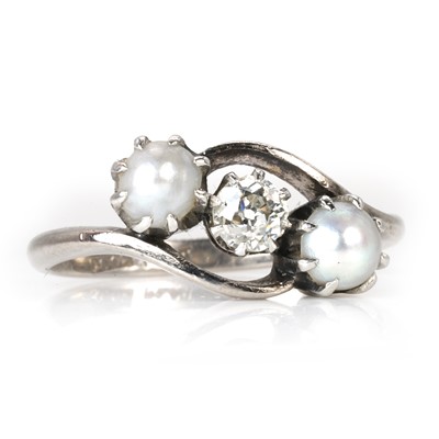 Lot 124 - A diamond and cultured pearl three stone ring