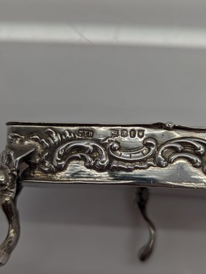 Lot 28 - A group of silver novelty musical instruments