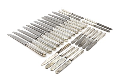 Lot 34 - A set of twelve silver handled knives