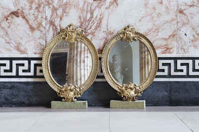 Lot 217 - A pair of oval wall mirrors