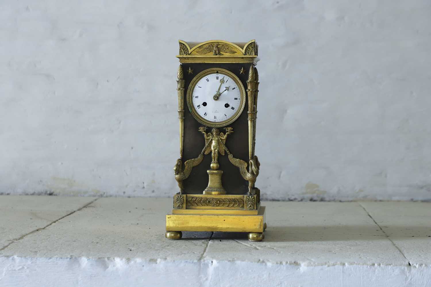 Lot 63 - A French Empire ormolu cased mantel clock