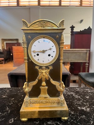 Lot 63 - A French Empire ormolu cased mantel clock