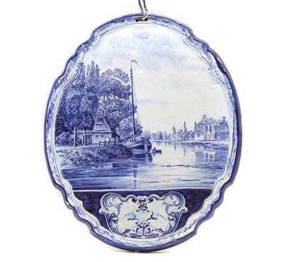 Lot 137 - A Delft pottery wall plaque