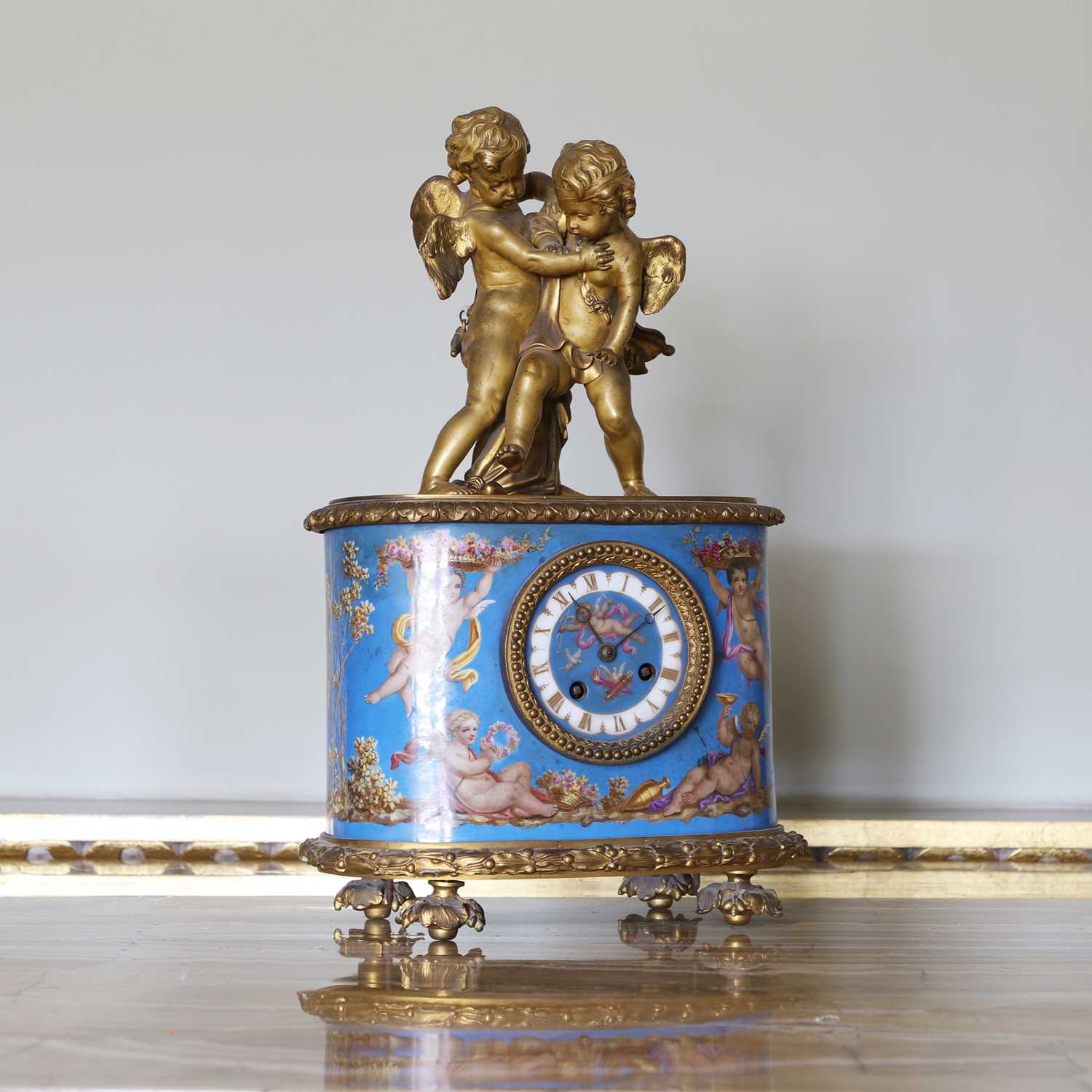 Lot 203 - A porcelain and ormolu-mounted mantel clock