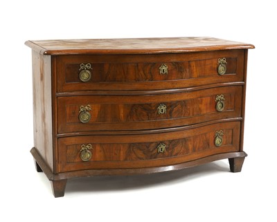 Lot 679 - A walnut commode