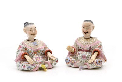 Lot 138 - A pair of porcelain nodding pagoda figures