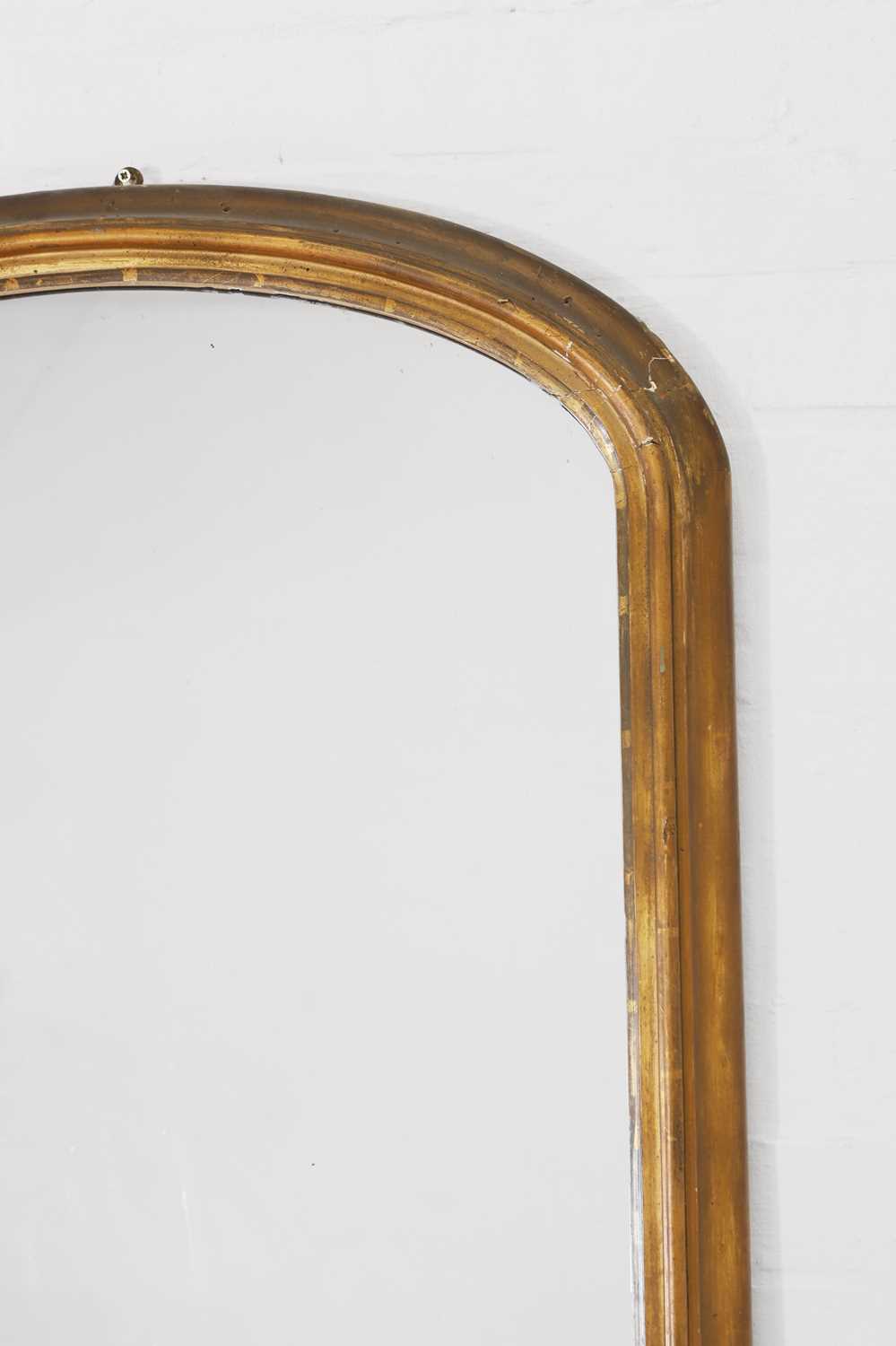Lot 179 A giltwood overmantel mirror,