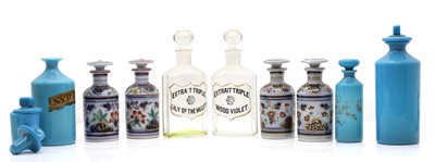 Lot 188 - A graduated group of three opaline glass apothecary bottles