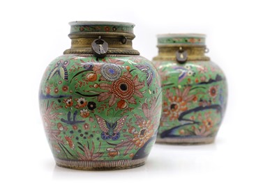 Lot 173 - A pair of Chinese clobbered jars and covers