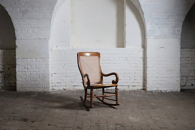 Lot 176 - A Victorian beech rocking armchair