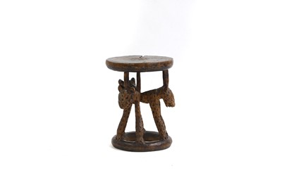 Lot 483 - An African carved stool