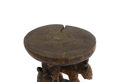 Lot 483 - An African carved stool