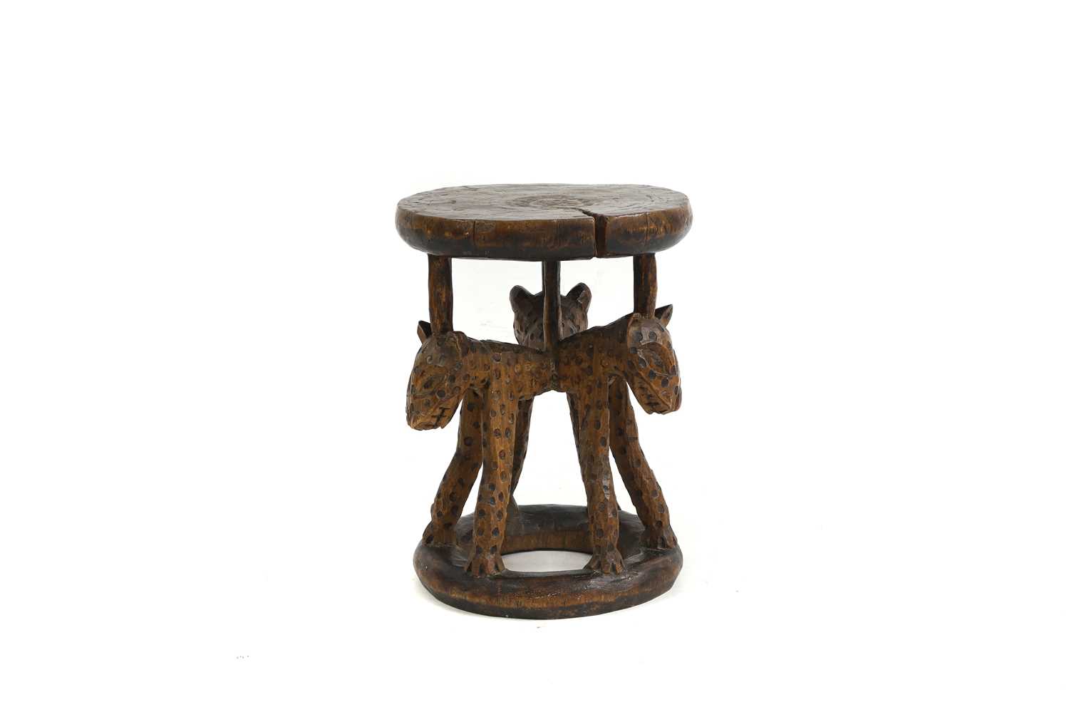 Lot 483 - An African carved stool