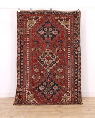 Lot 419 - A tribal wool rug