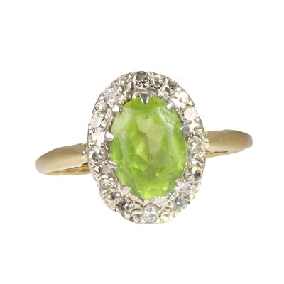 Lot 155 - An 18ct gold peridot cluster ring