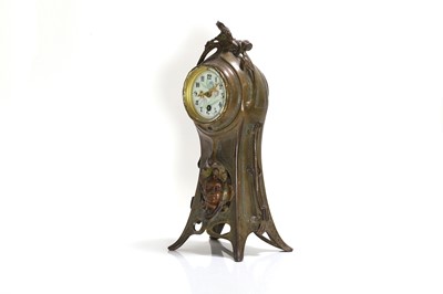 Lot 47 - A French Art Nouveau patinated bronze mantel clock