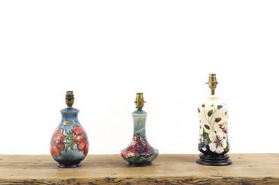 Lot 219 - A group of three Moorcroft pottery lamps