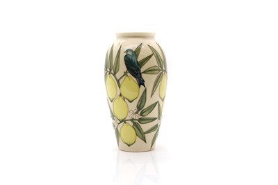 Lot 214 - A Moorcroft pottery 'Lemons' pattern vase