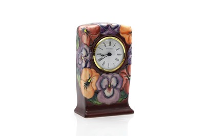 Lot 211 - A Moorcroft 'Pansy' pattern clock