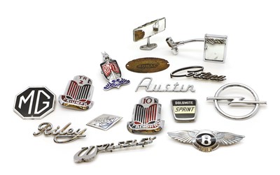 Lot 15 - A Triumph TR2 car badge and others