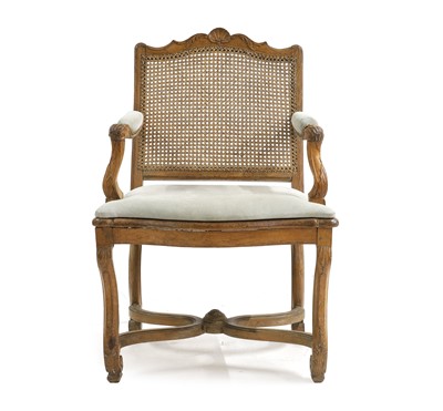 Lot 517 - A Louis XV provincial beechwood caned fauteuil