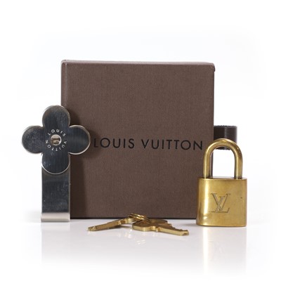 Lot 581 - A Louis Vuitton flower money clip and padlock