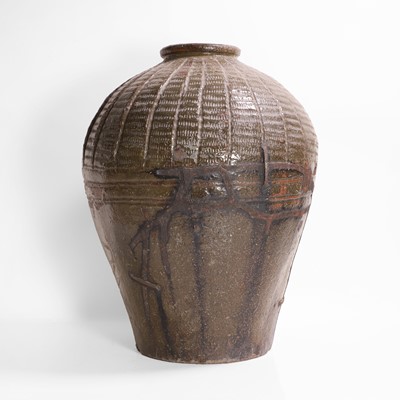Lot 137 - A large green-glazed pottery vase