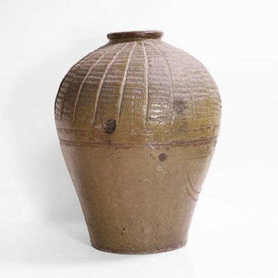 Lot 137 - A large green-glazed pottery vase