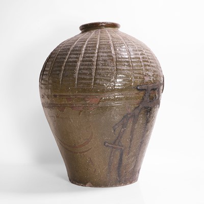 Lot 137 - A large green-glazed pottery vase
