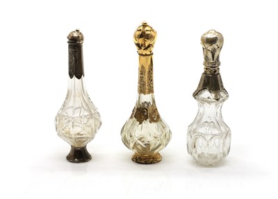 Lot 127 - A group of three cut glass scent bottles