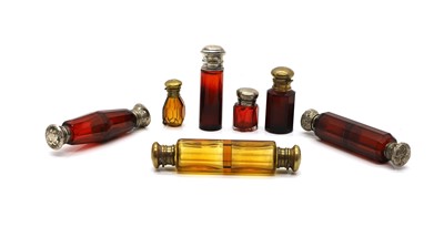 Lot 126 - A group of cranberry glass scent bottles