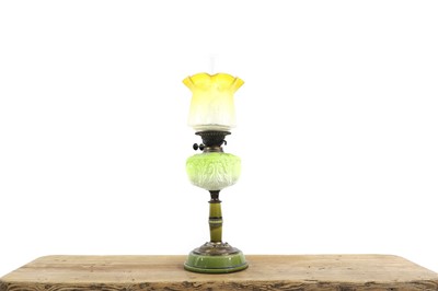 Lot 330 - A Victorian moulded green glass oil lamp