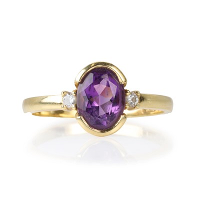 Lot 216 - An 18ct gold amethyst and diamond ring