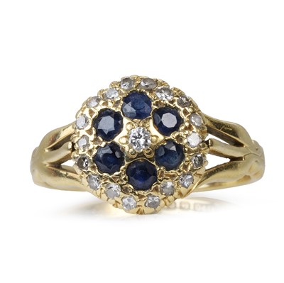 Lot 180 - An 18ct sapphire and diamond cluster ring