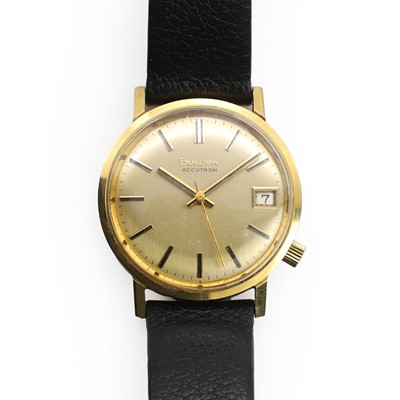 Lot 543 - A 9ct gold Bulova mechanical strap watch