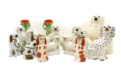 Lot 209 - A group of Staffordshire pottery dogs