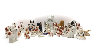 Lot 215 - A group of Staffordshire pottery dogs