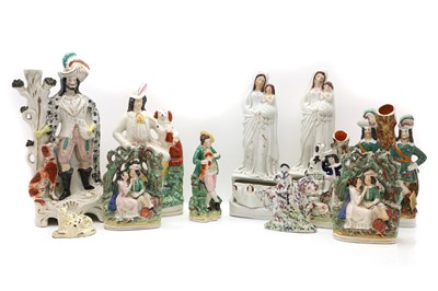 Lot 232 - A collection of Staffordshire pottery flatback figures