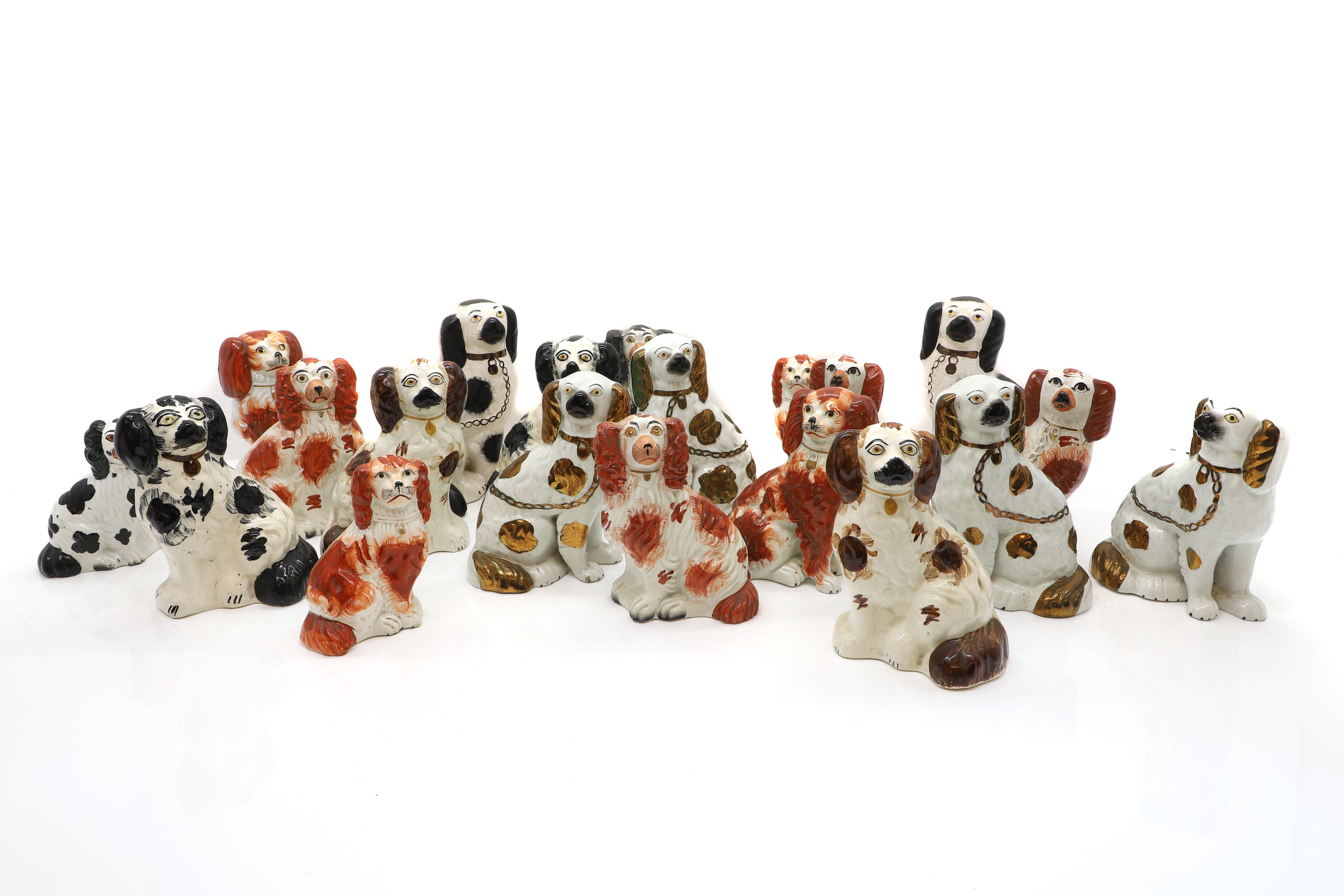 Lot 223 A group of Staffordshire spaniel dogs,