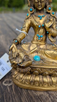 Lot 125 - A gilt-bronze bodhisattva