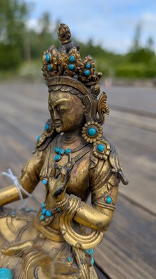 Lot 125 - A gilt-bronze bodhisattva