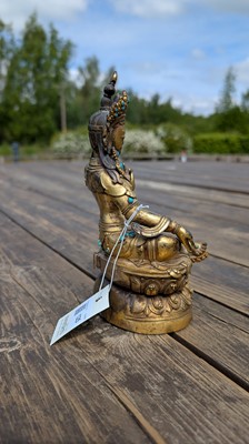 Lot 125 - A gilt-bronze bodhisattva