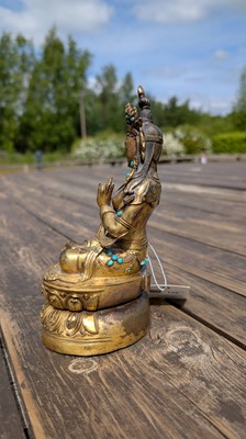 Lot 125 - A gilt-bronze bodhisattva