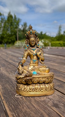 Lot 125 - A gilt-bronze bodhisattva