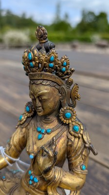 Lot 125 - A gilt-bronze bodhisattva