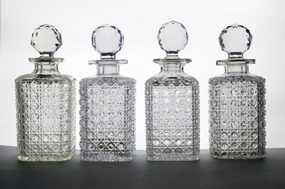 Lot 314 - A collection of four cut glass spirit decanters