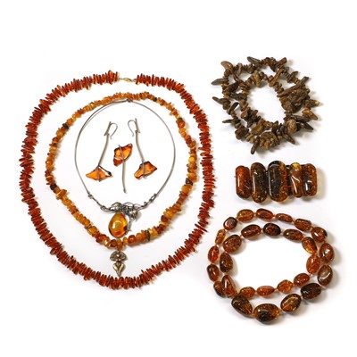 Lot 1360 - A group of amber bead jewellery