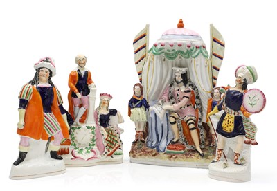 Lot 144 - A group of Staffordshire pottery figures