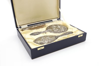 Lot 31 - A cased silver dressing table set